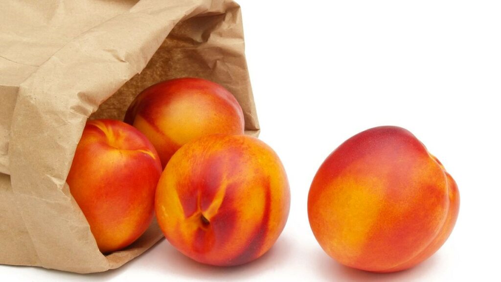 Ripe Apricots In Paper Bags